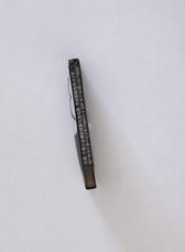 A defective cell phone lithium ion battery which has expanded out of shape