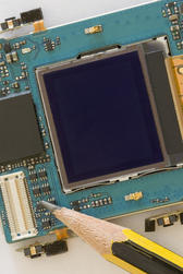 Macro image of the circuit board from a flip-phone mobile