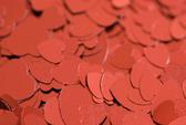 a background of metallic red heart symbols