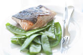 Pan fried salmon steak served with succulant sugarsnap peas in their pods