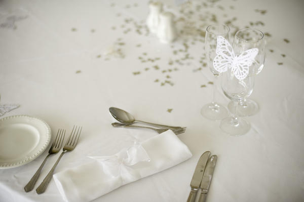 a white wedding breakfast table setting Image Description