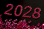 the year 2028 written out in red glittering jewels