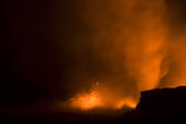 long exposure photo of view of lava entering the ocean spewing clouds of steam, near Kalapana, Hawaiis Big Island 
