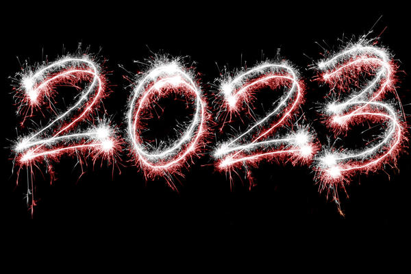white and red new year 2023 sparkling typeface on back backdrop