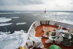 Bows of the Aurora icebreaker clearing a channel for shipping through the winter drift ice in the ocean off Hokkaido